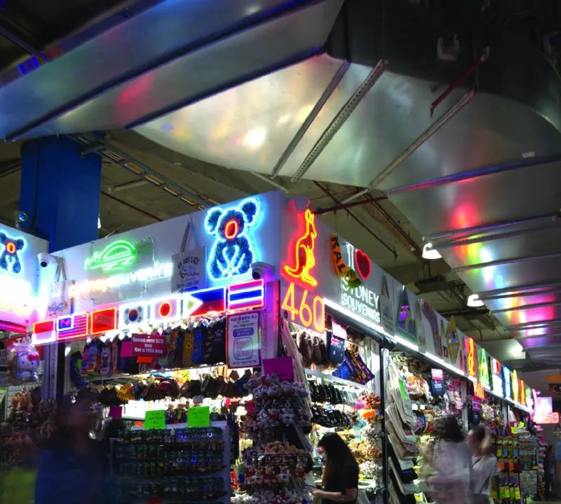 The neon-lit 460 Sydney Souvenirs storefront