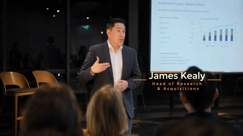 Presenter speaking to the room at an Inspired Wealth event