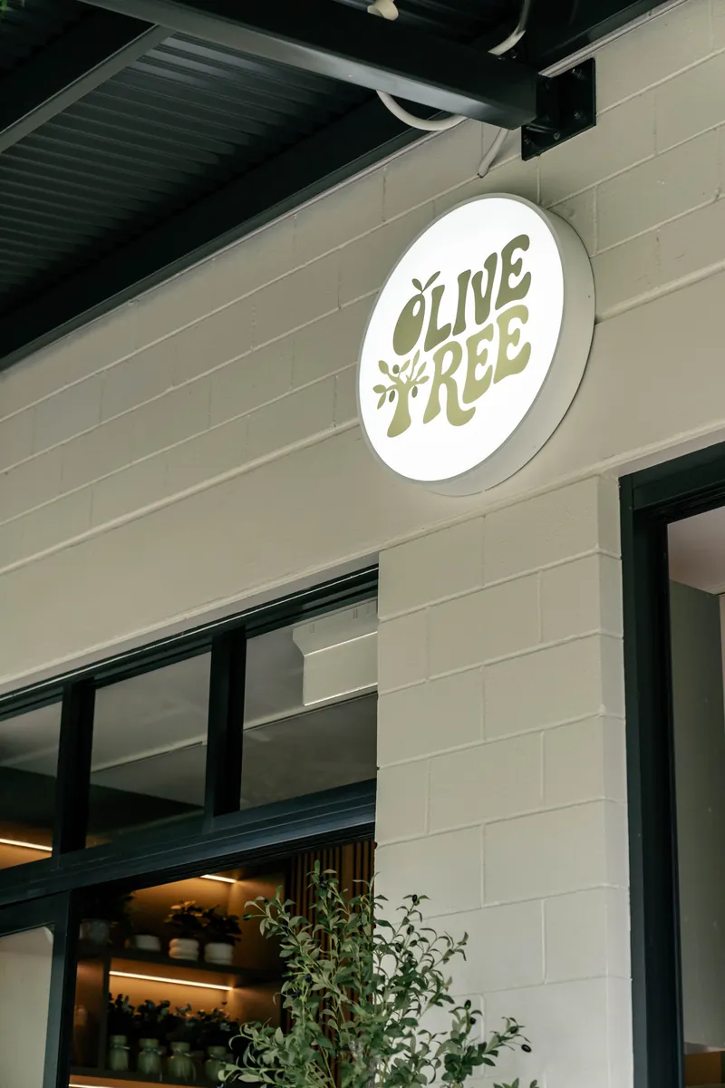 The Olive Tree Cafe logo on the cafe wall