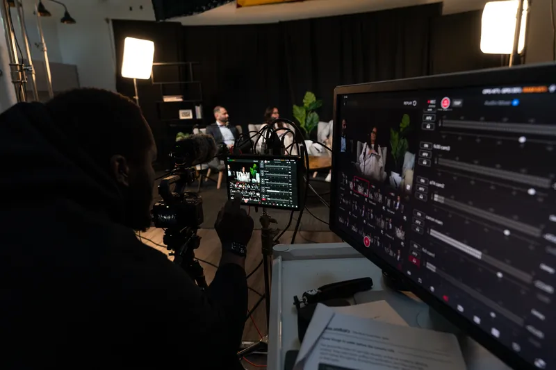 Monitor showing the multi-camera feed during a podcast recording